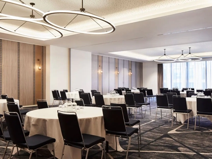 A conference and meeting room in the Hyatt Hotel, with lots of chairs and tables