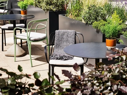 A chair and table outside in the sun on the terrace at the Hyatt Regency