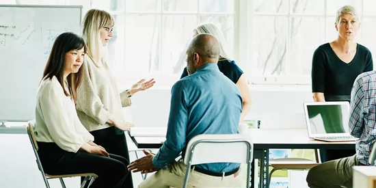 A group of work colleagues having a discussion