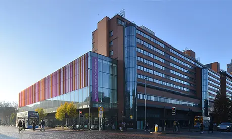 Alliance MBS building taken from Oxford Road on a blue sky day.