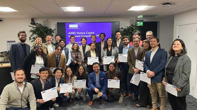 A group of participants stood together, smiling and holding certificates in the VCIC