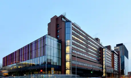 The AMBS building in the evening