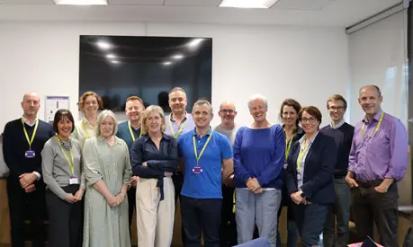 A group of senior leaders from National Trust gathered in a classroom at AMBS