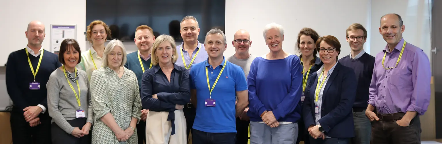 A group of senior leaders from National Trust gathered in a classroom at AMBS