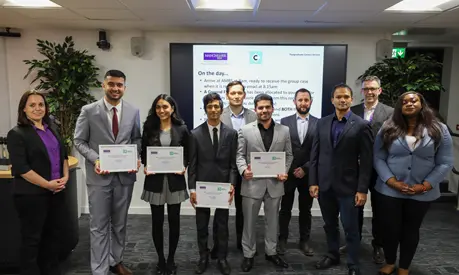 A group of the winners of the MBA Case Interview Competition holding certificates