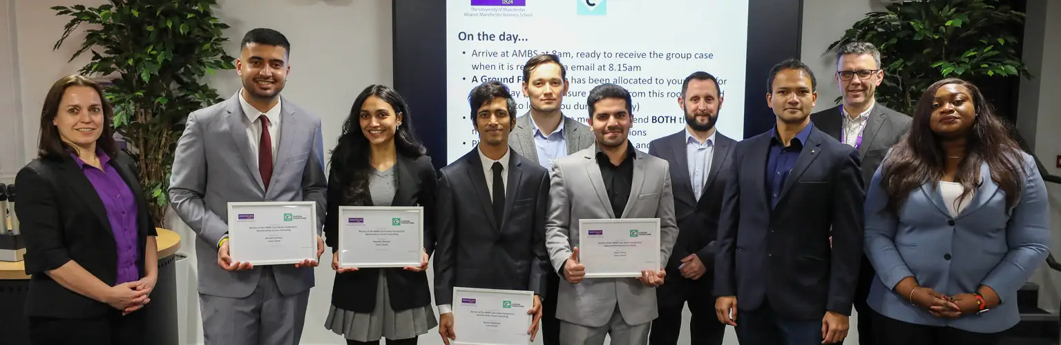 A group of the winners of the MBA Case Interview Competition holding certificates