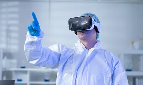 A healthcare professional in a white coat wearing a VR headset and interacting with the tool.