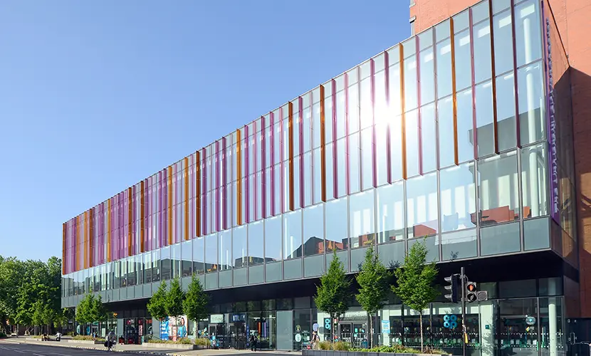 Alliance MBS building taken from Oxford Road on a blue sky day.