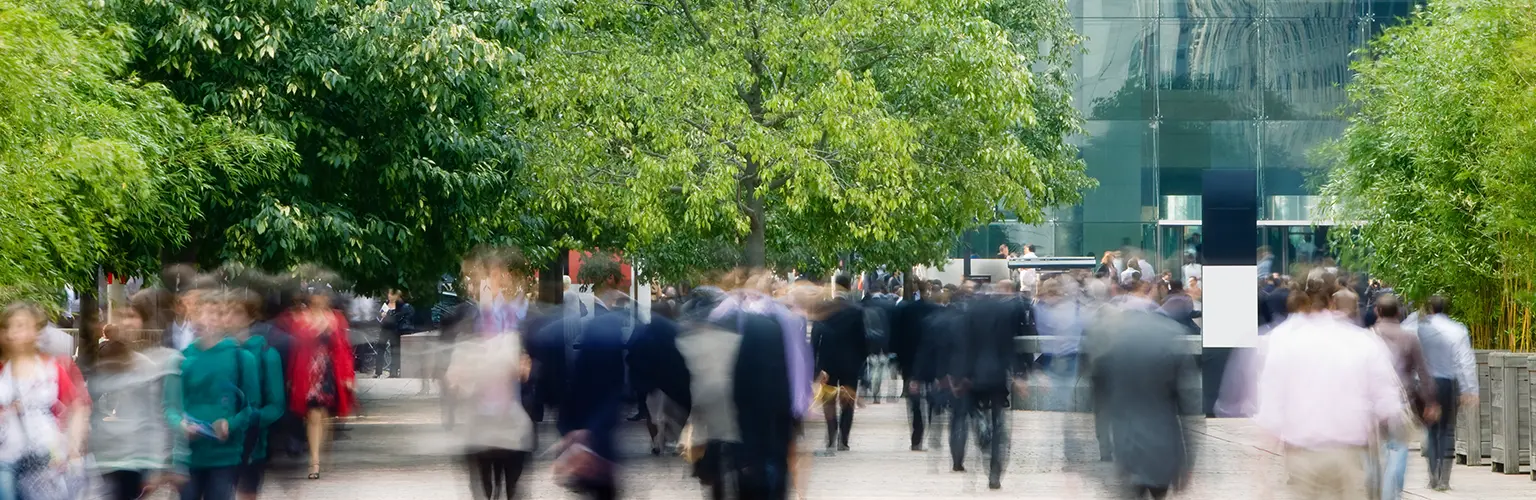 Commuters walking in a business area in blurred motion