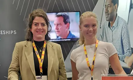 AMBS representatives at the CIPD Festival of Work 2025, standing at the Executive Education exhibition stand